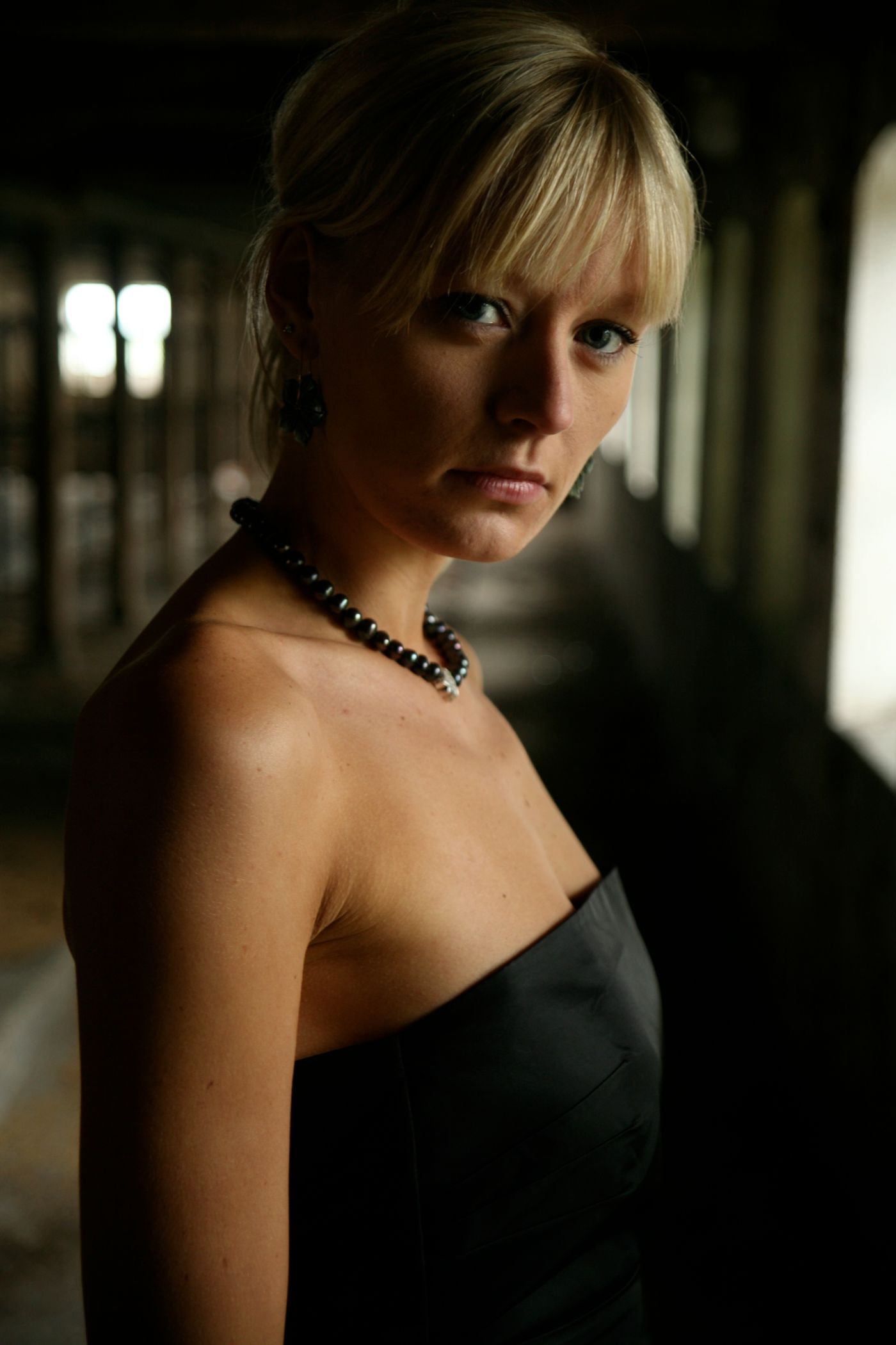 Portrait of a woman in a black dress wearing jewellery